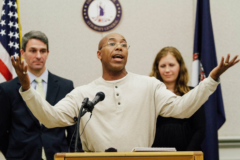Virginia Attorney General Ken Cuccinelli, Thomas Hanesworth, who spent 27 years behind bars, and Shawn Armbrust, of the Mid Atlantic Innocence Project, right, in Richmond, Va., Tuesday, Dec. 6, 2011.